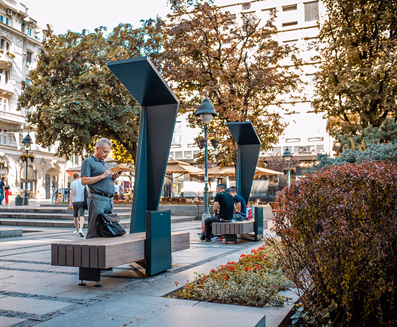 Solar smart benches deployed in a public plaza