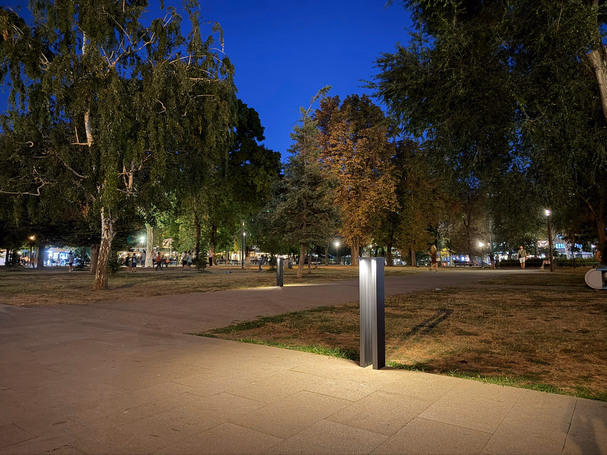 LED Bollard lighting a public plaza at dusk