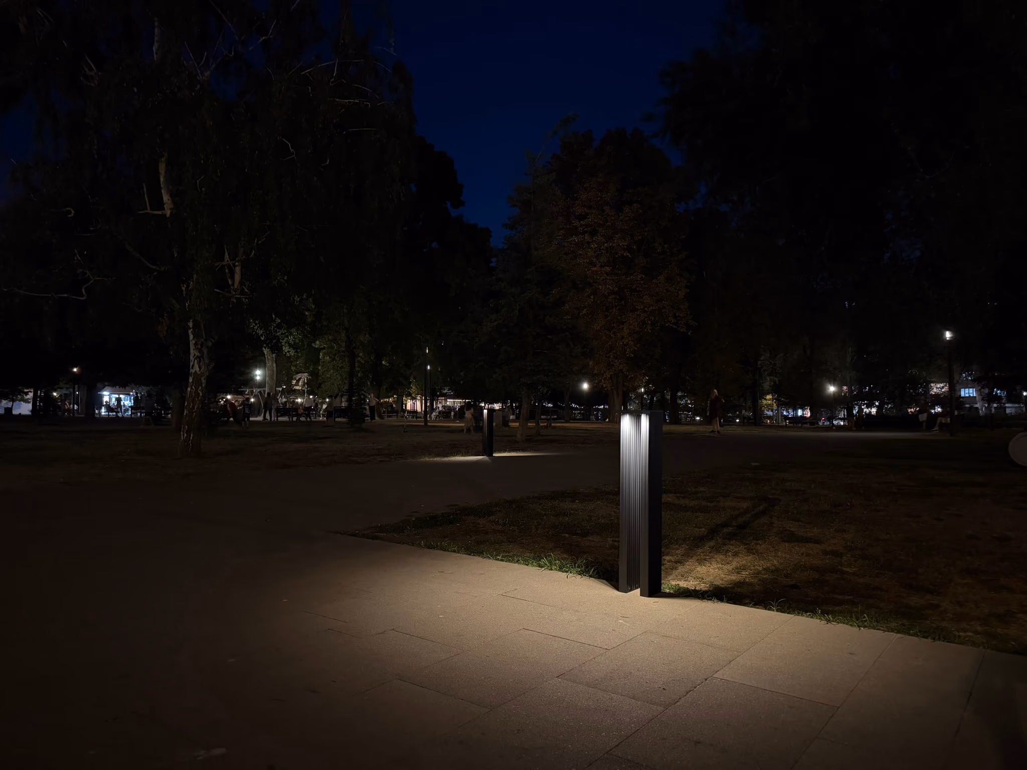 LED Bollard pair lighting a park path at night