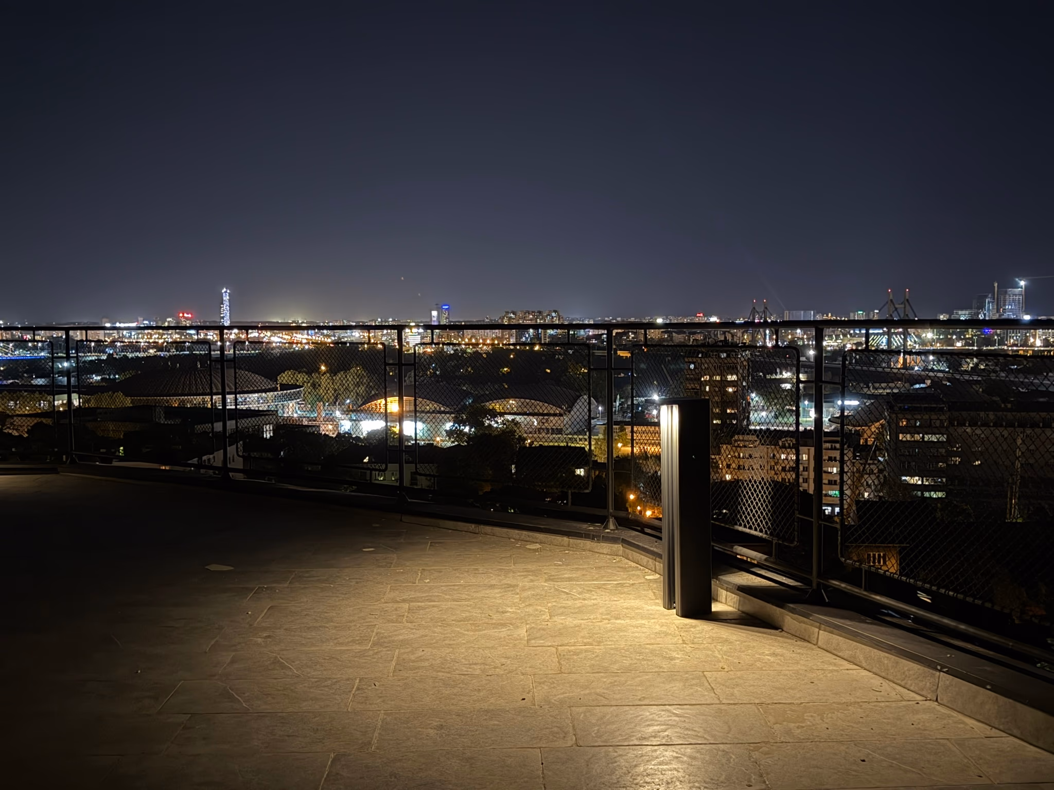 LED Bollard on a rooftop terrace overlooking the city at night
